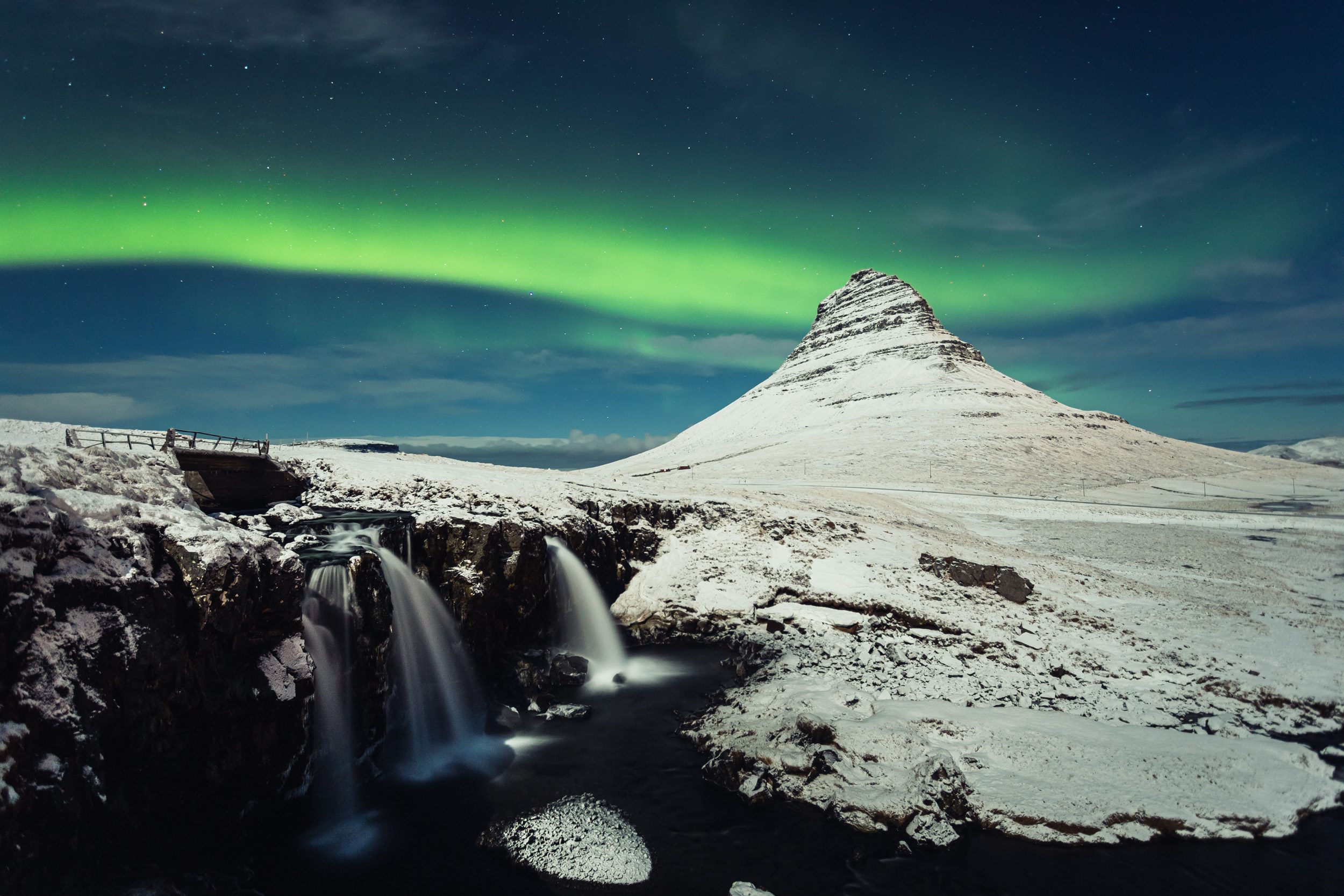 The Aurora Borealis dancing above Kirkjufell mountain in West Iceland.
