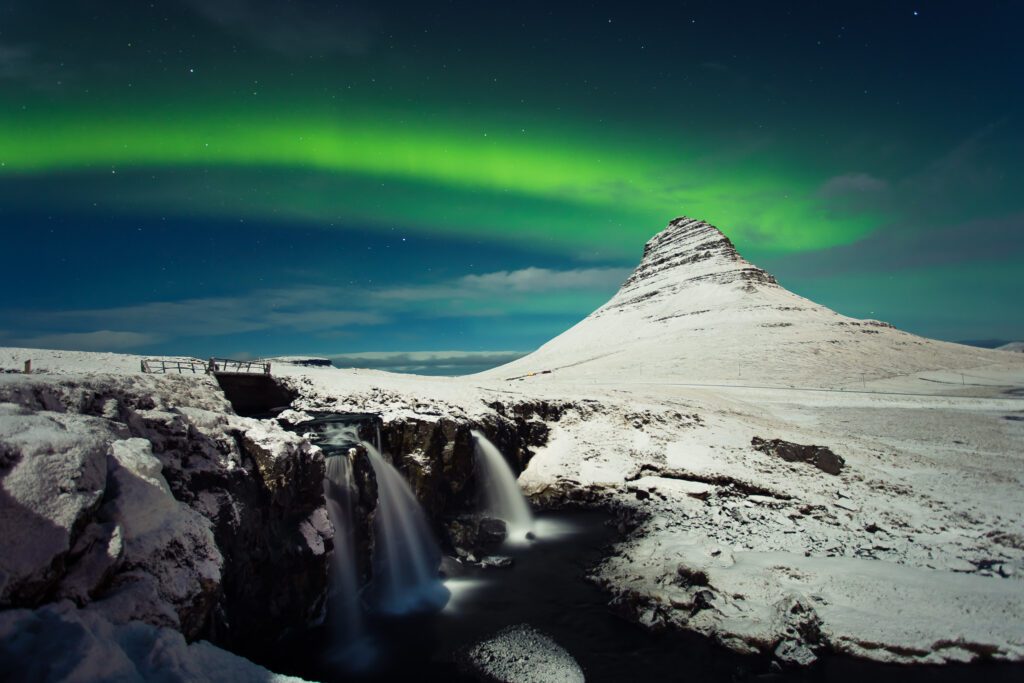 Aurora above Kirkjufell mountain in Iceland