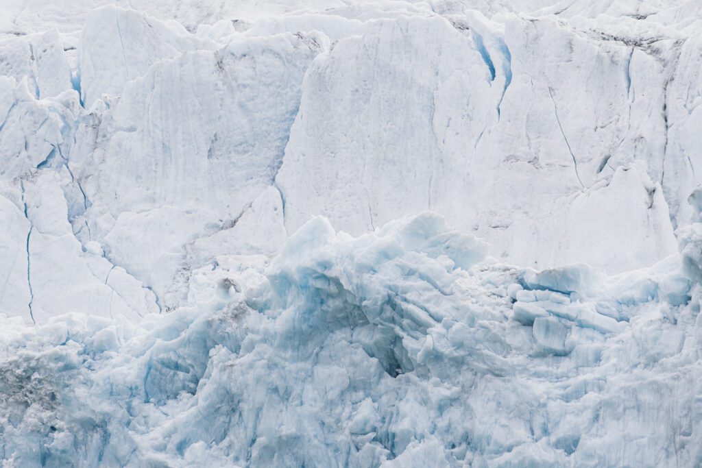 Close-up of fractured blue ice on a Svalbard glacier face.