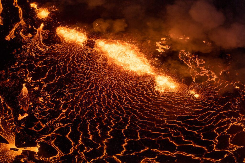 Aerial of a fissure eruption with multiple lava fountains along the vent line.