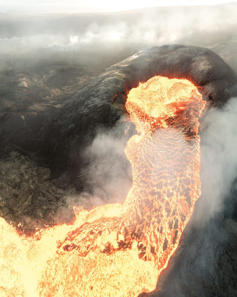 Aerial drone view of lava overflowing the rim of a cinder cone with steam pouring out.