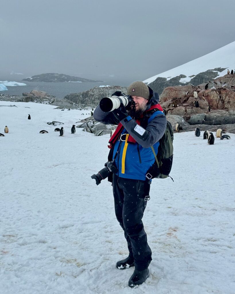 Photographing penguins on Petermann Island on the Antarctic Peninsula.