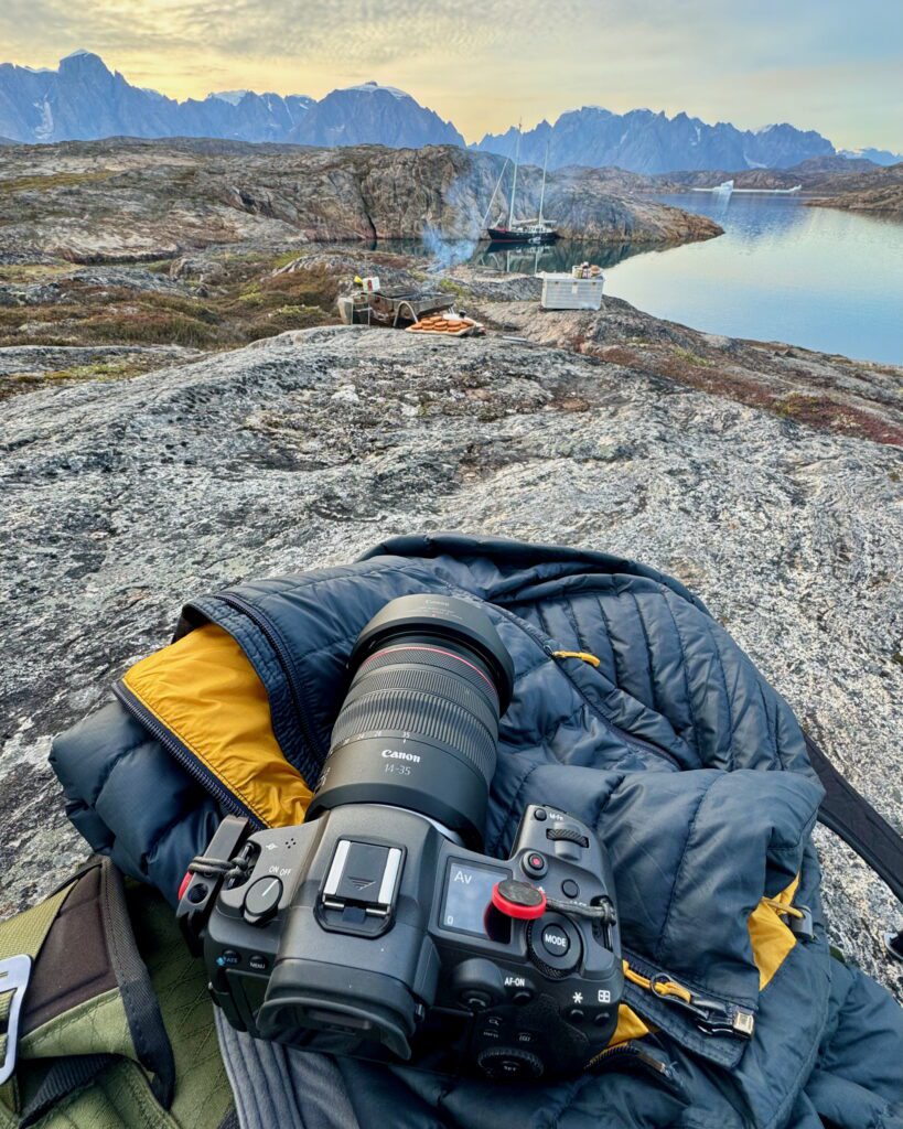 Eastern Greenland: Exploring The Solitude of Scoresbysund Canon camera on top of my bag on the Bear Islands